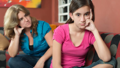 Teenage problems - Teenage girl with her sad and worried mother