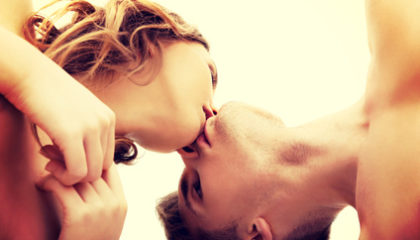 Young beautiful caucasian couple kissing.